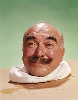 Flushed: 1960s Head Of Bald Man With Moustache