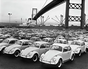 Inexpensive: 1960s LOADING DOCK WITH PARKED VOLKSWAGEN BEETLES