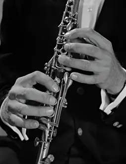 Oboe: 1960s MALE HANDS PLAYING CLARINET
