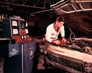 Diagnostic: 1960s Man Auto Mechanic Working
