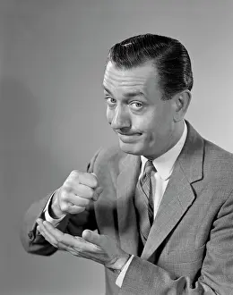 Pounding: 1960s Man Determined Businessman