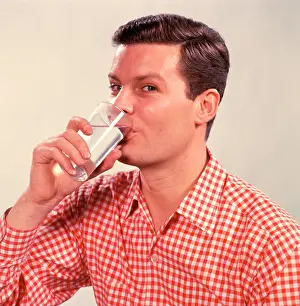 Quench: 1960s Man Drinking Glass Water