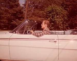 Convertibles: 1960s Man Driving White Convertible