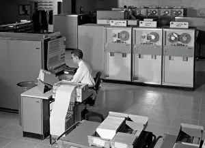 Programming: 1960s MAN PROGRAMMING LARGE MAINFRAME COMPUTER