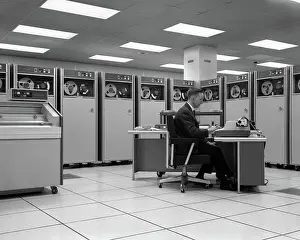 Programming: 1960s MAN TECHNICIAN PROGRAMMING MAINFRAME COMPUTER