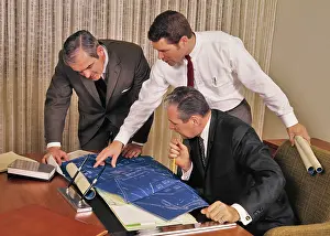 Blueprints: 1960s Three Men looking over Blueprints Architectural Dra