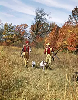 Gunning: 1960s Two Men Walking In Autumn