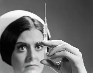 Dosage: 1960s NURSE ADJUSTING DOSAGE INJECTION HYPODERMIC