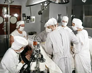 Coordinate: 1960s operating room team with scrub and circulating