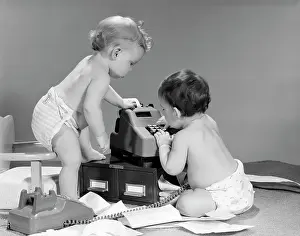 Calculate: 1960s PAIR OF BABIES AROUND ADDING MACHINE WITH