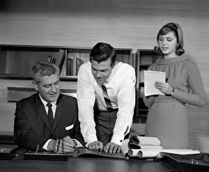 Businesspeople: 1960s Pair Of Businessmen Behind