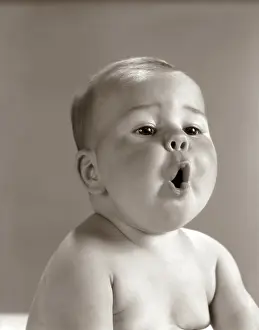 Reacting: 1960s PORTRAIT BABY WITH CHUBBY CHEEKS MAKING