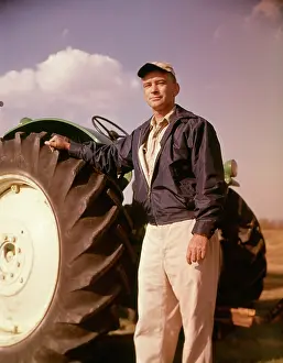 Grown Up: 1960s Portrait of Serious Man Farmer Standing Beside Larg