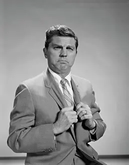 Glare: 1960s PORTRAIT MIDDLE AGED MAN STERN SERIOUS