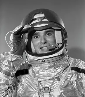 Spaceman: 1960s PORTRAIT OF SMILING ASTRONAUT IN SPACE