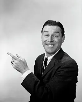 Spokesperson: 1960s Smiling Happy Man Look At