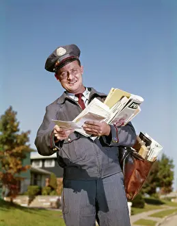 Mailbag: 1960s Smiling Mailman Holding