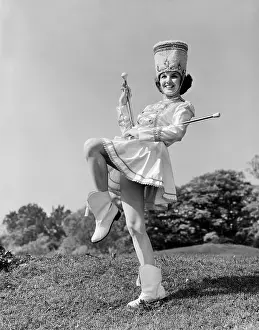 Marcher: 1960s SMILING MAJORETTE IN UNIFORM WITH SHORT