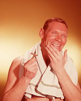 Shaves: 1960s Smiling Man Holding Razor