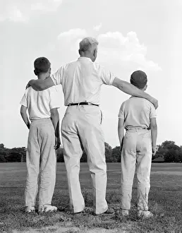 Grandsons: 1960s Two Sons Boys Man Looking Out From Behind