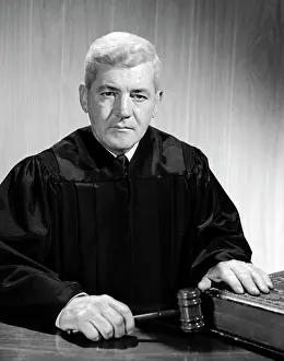 Gavel: 1960s Stern-Looking Judge Seated