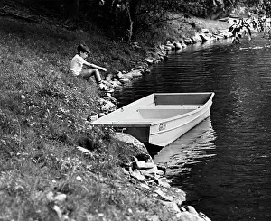 Morose: 1960s Side View Of Boy Sitting