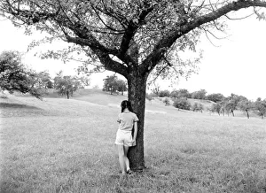 Insecure: 1960s back view of girl standing