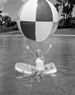 Cyp001: 1960s Young Woman On Inflatable