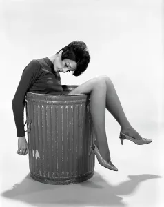 Worthless: 1960s Young Woman In Trash Can