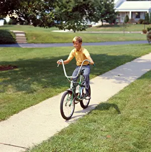 Handlebars: 1970s Blond Boy Biking With Chopper