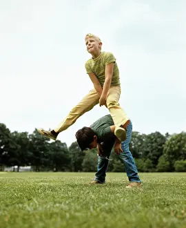 Leapfrog: 1970s Two Boys Jumping Playing