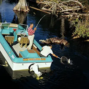Outboard: 1970s Two Elderly Men Fishing