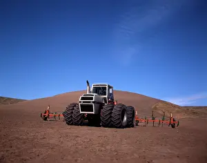 Plowed: 1970s FARM TRACTOR PULLING WEEDER APPARATUS IN