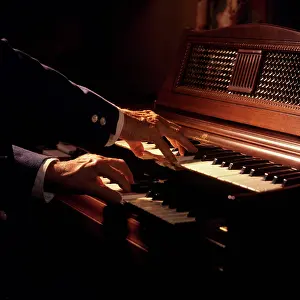 Wurlitzer: 1970s Hands Playing A Wurlitzer Organ Keyboard