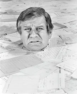 Overworked: 1970s Man Up To His Neck In Bills