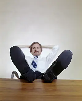 Inappropriate: 1970s Man Sitting With Feet Up