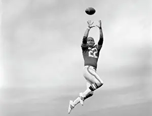 Coordinate: 1970s Player Jumping To Catch