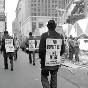 Picketers: 1970s Rear View Of Man Walking