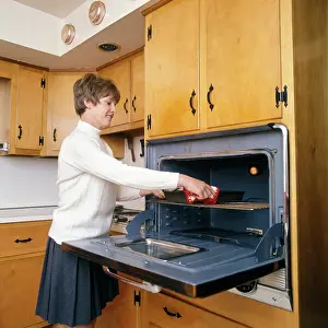 Casserole: 1970s Smiling Housewife In Kitchen