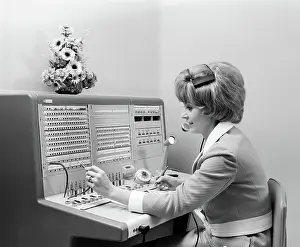 Receptionist: 1970s SMILING WOMAN OPERATOR RECEPTIONIST WORKING