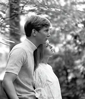 Romantics: 1970s Side View Of Couple Standing