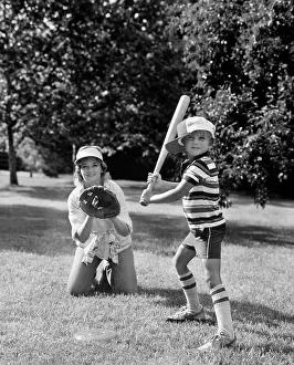 Mitt: 1980s Boy At Bat With Mother Kneeling
