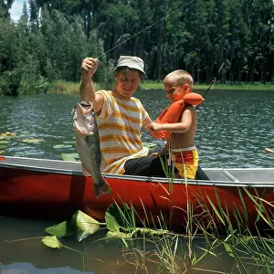 Preserver: 1980s Father & Son In Canoe Holding