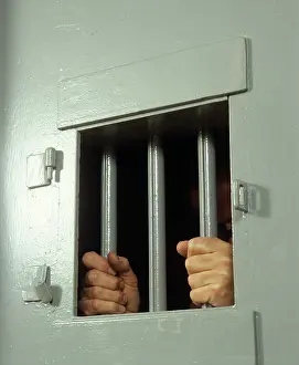 Correctional: 1980s HANDS ON JAIL CELL BARS