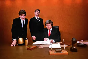 Devious: 1980s Three Sharp Aggressive Business Executives looking