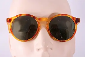 Lenses: 1980's tortoise shell sunglasses, dark tinted