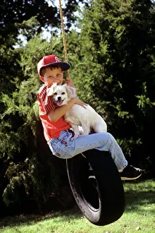 Mutt: 1990s BOY AND DOG RIDING ON TIRE SWING