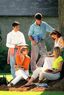 Deg002: 1990s Five College Students with Textbooks on Campus Talk