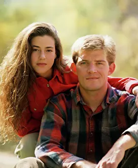 Del003: 1990s Portrait of Serious Young Couple looking at Camera