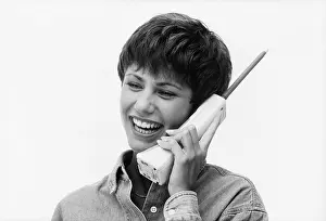 Cordless: 1990s Smiling Woman Talking On